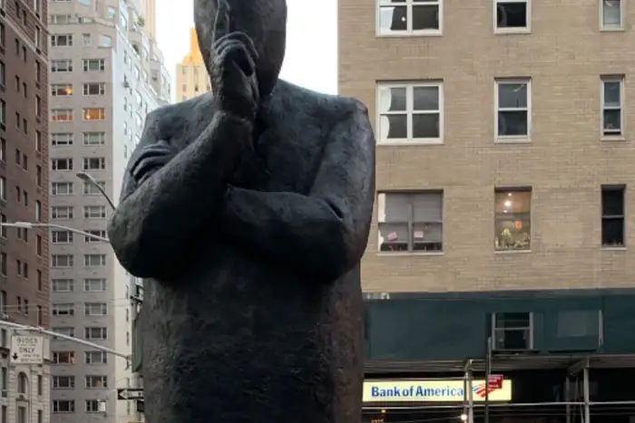 This is a photo of Jim Rennert's "Listen" sculpture, installed in Midtown Manhattan.